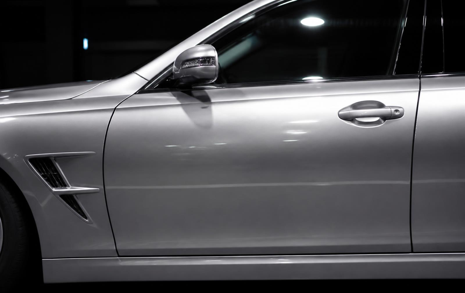 Silver car after professional detailing with mirror gloss paint