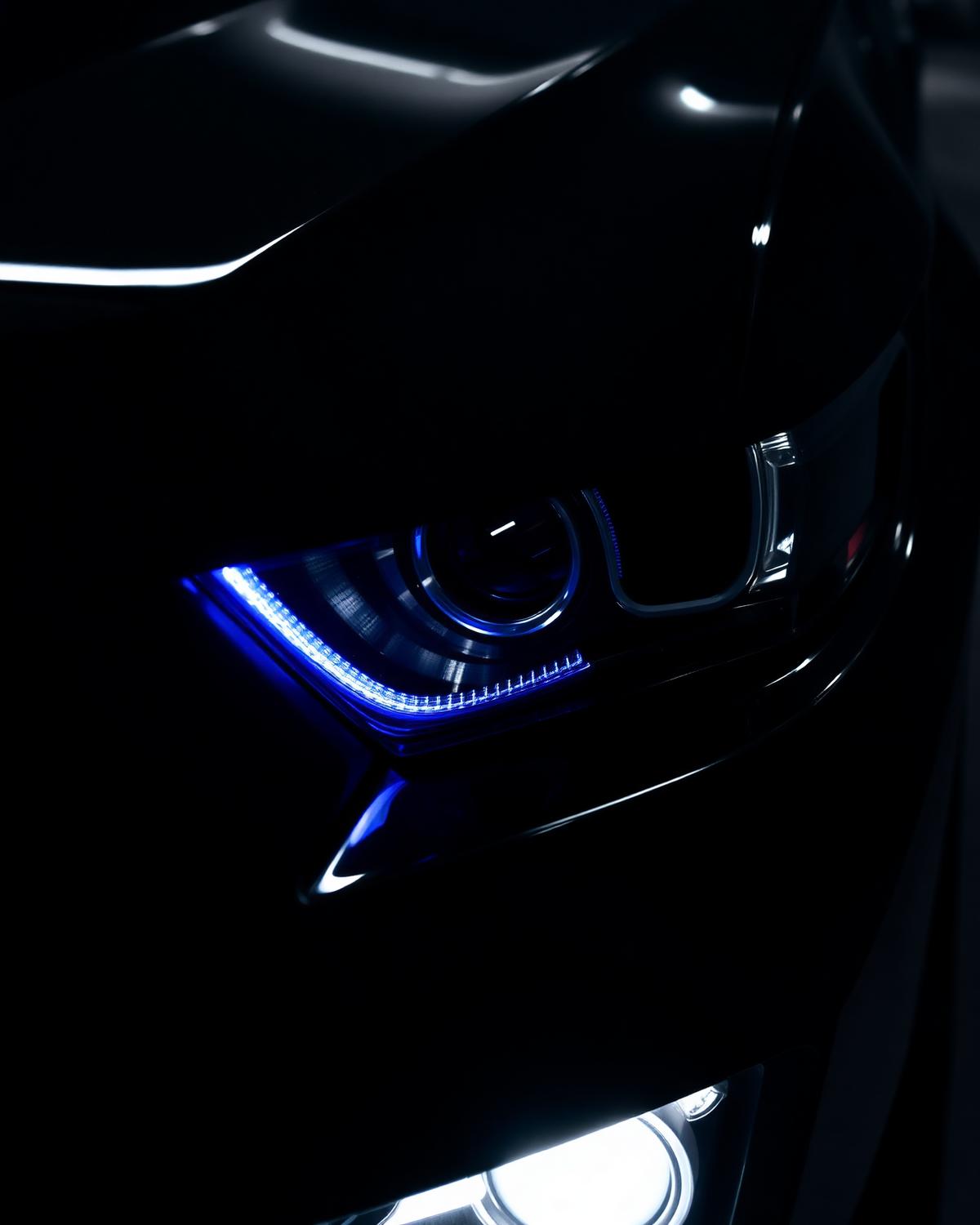 Paint correction detail on a black car front end